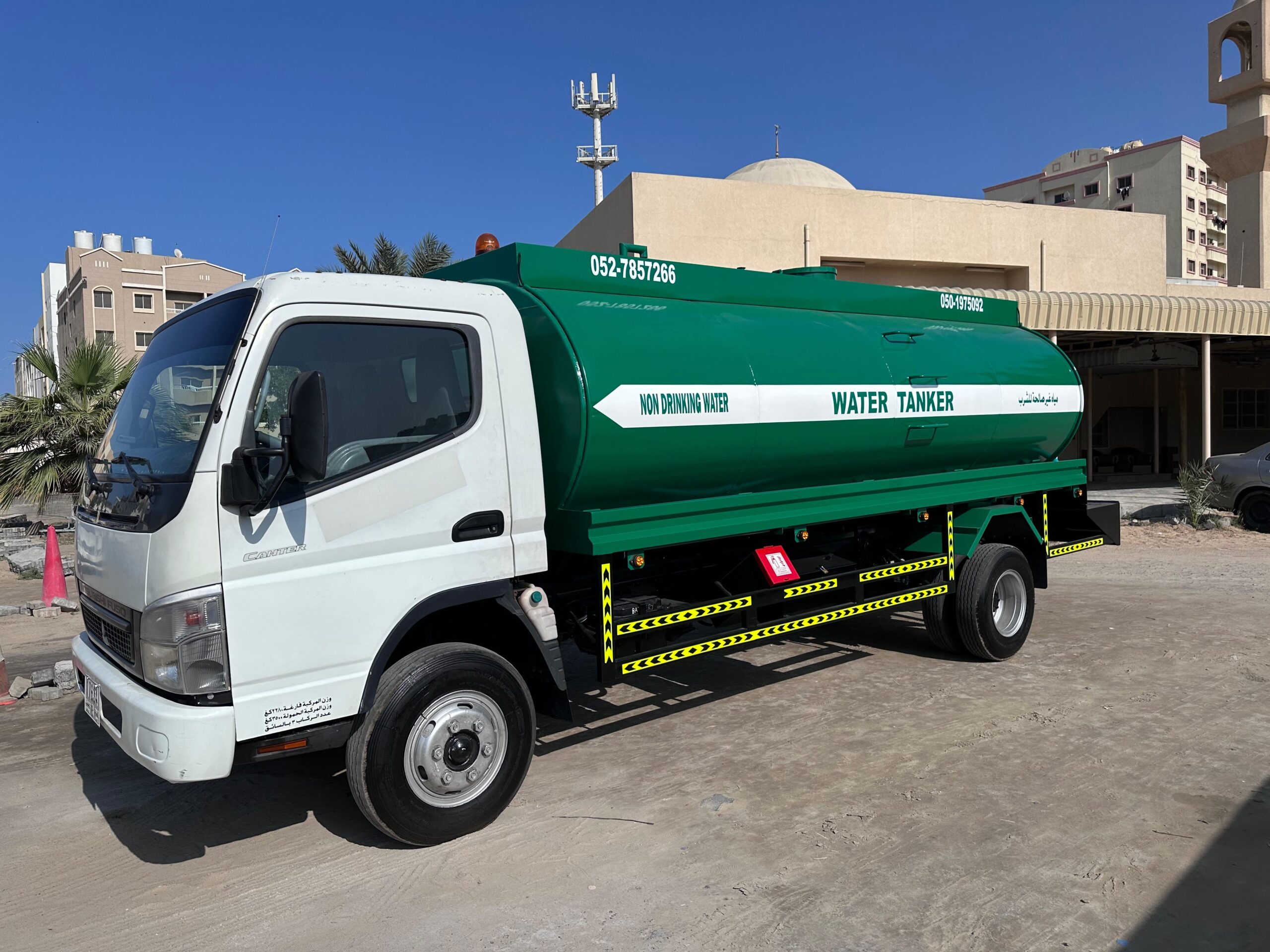 Drinking water supply truck near a construction site in Dubai